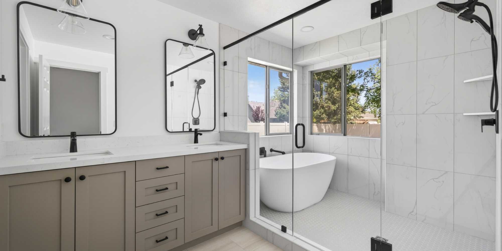 A bathroom remodel in Salt Lake City with a glass shower, soaking tub, and dual sinks by Marshall Homes
