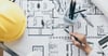 Stock Image of a person looking over some plans for a custom home in Salt Lake City, UT