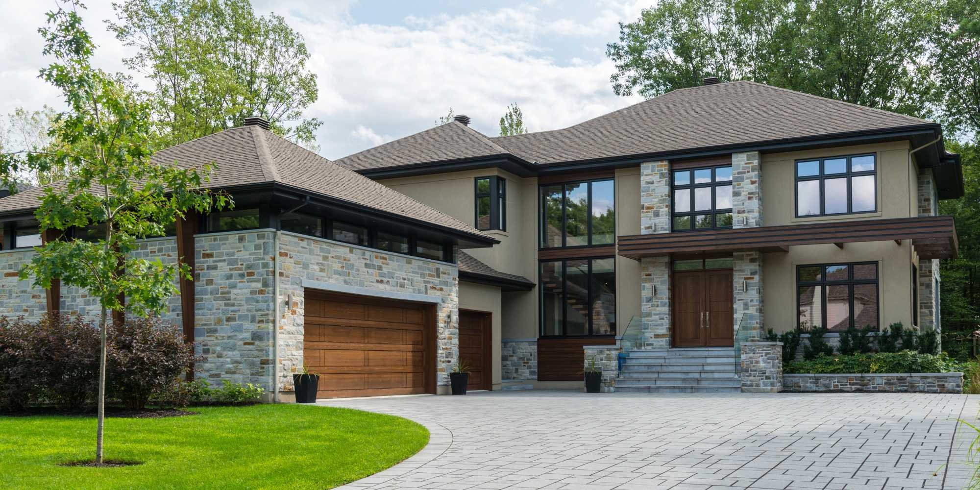 Salt Lake City custom home by Marshall Homes featuring elegant stonework and wood accents