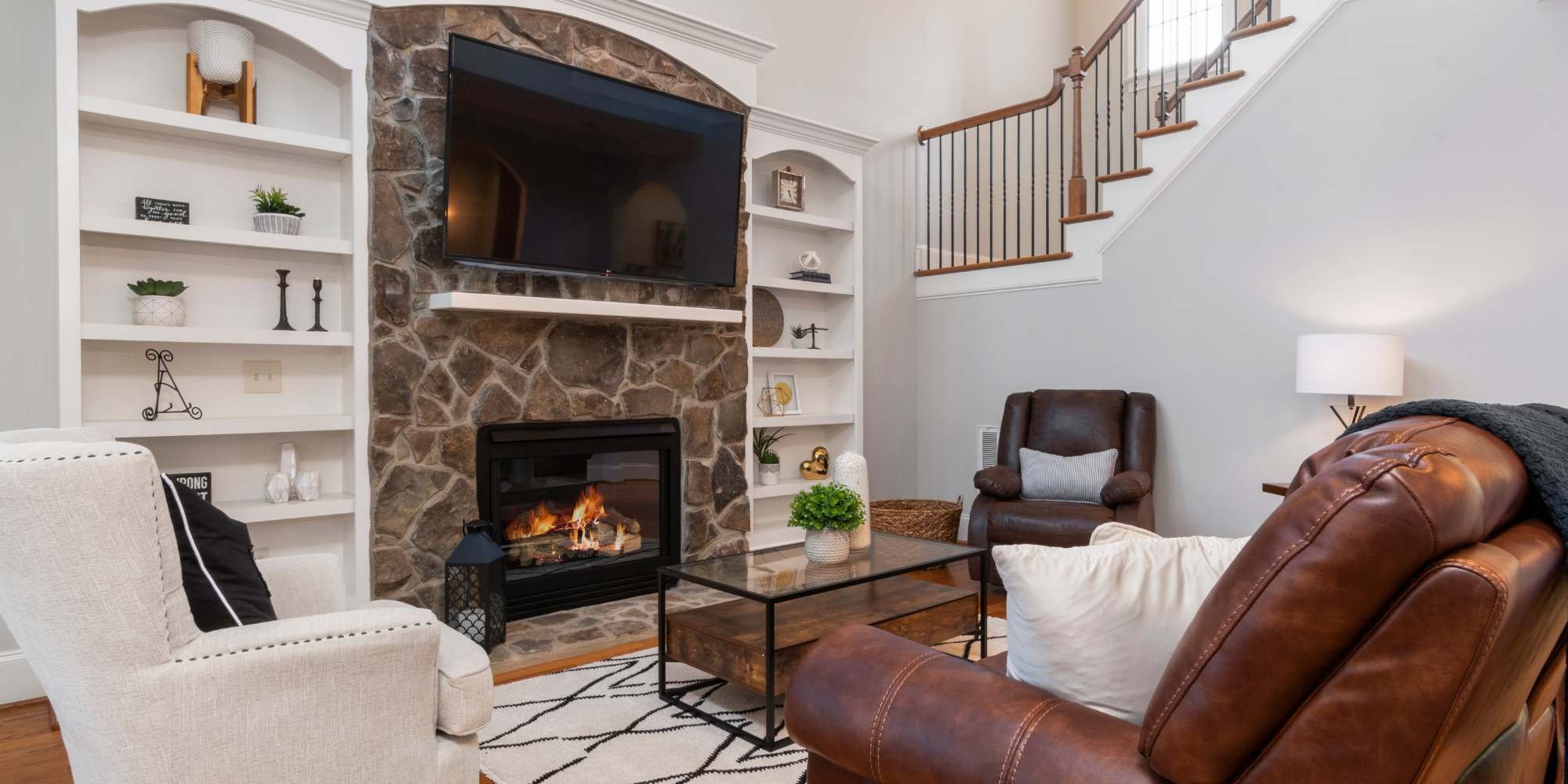 Elegant Salt Lake City home addition with stone fireplace and inviting living room design