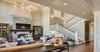 Spacious Salt Lake City living room addition with stone fireplace and stylish open layout
