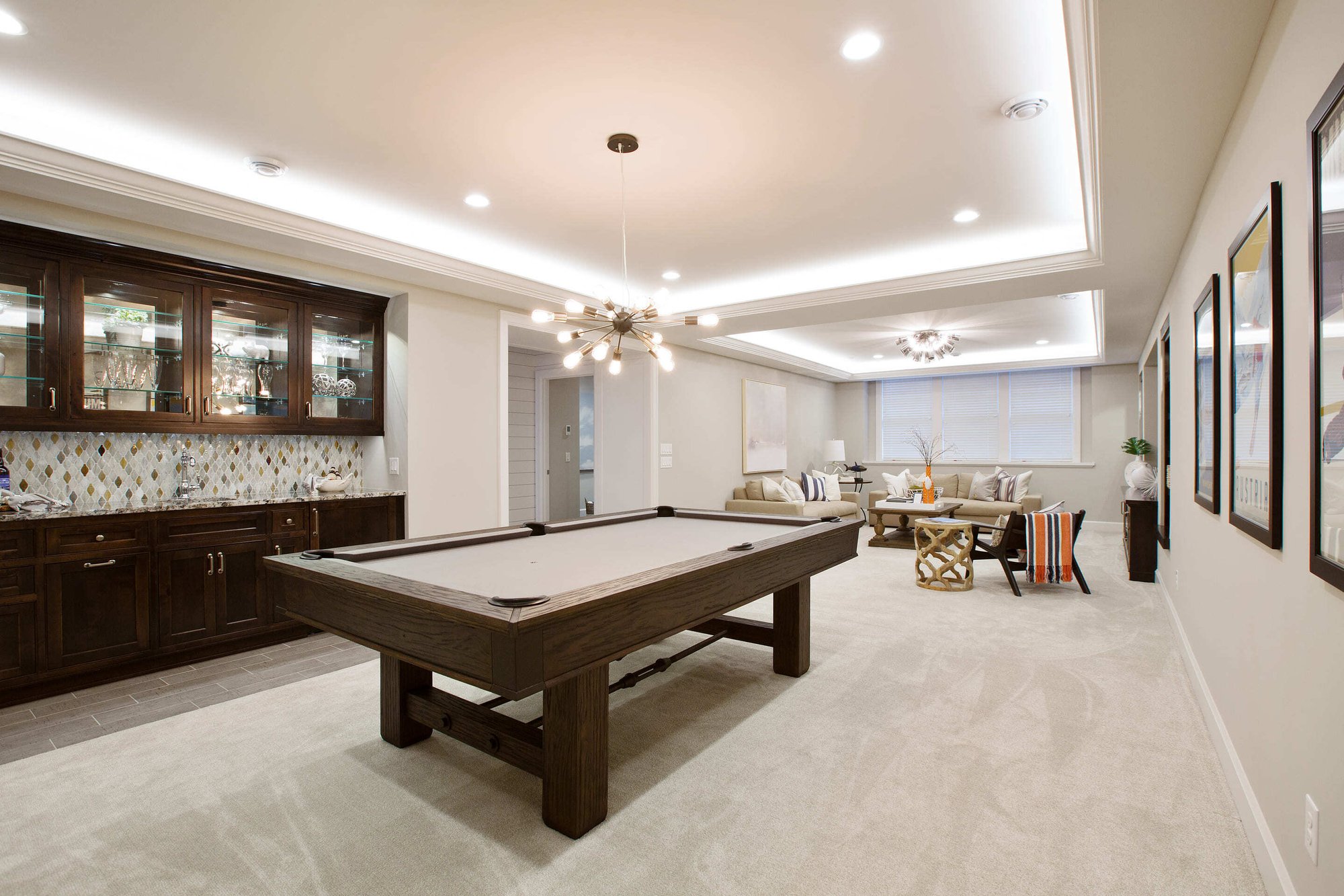 Recreation room with billiards table and seating area by Marshall Homes - Luxury Renovations - Home Builder - Utah