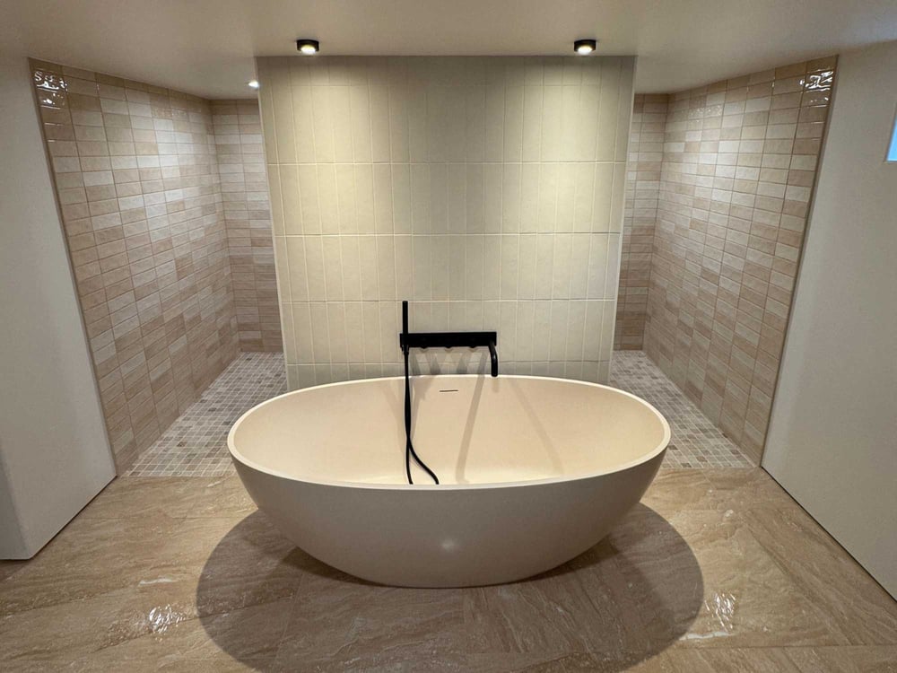 Photo of bathroom remodel in Holladay, UT by Marshall Homes featuring soaking tub and tiled showers
