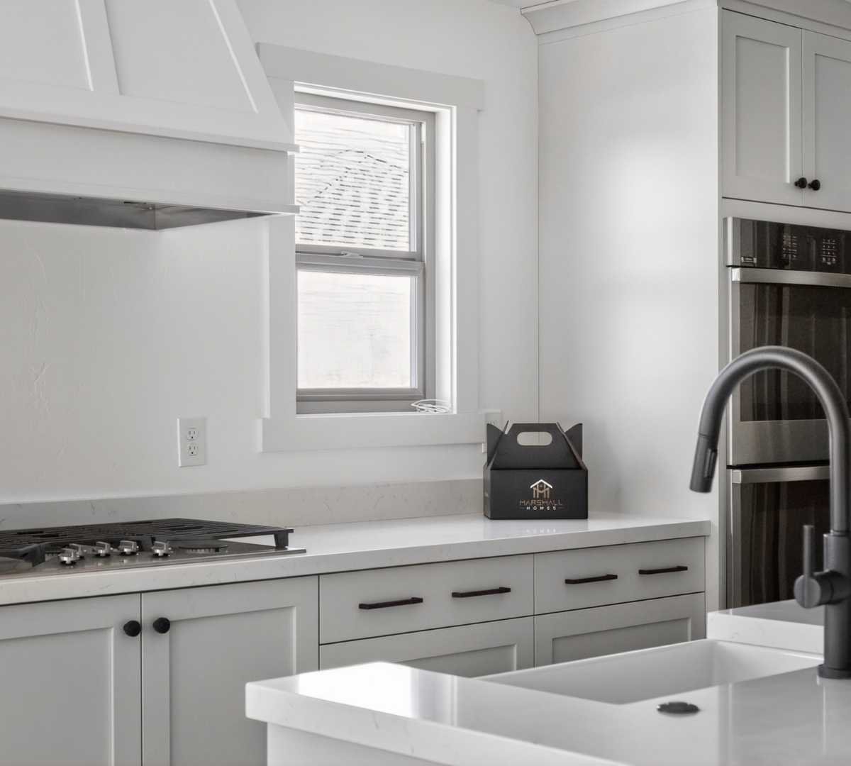 Image of custom kitchen remodel with shaker cabinets and built-in appliances by Marshall Homes in Herriman, UT