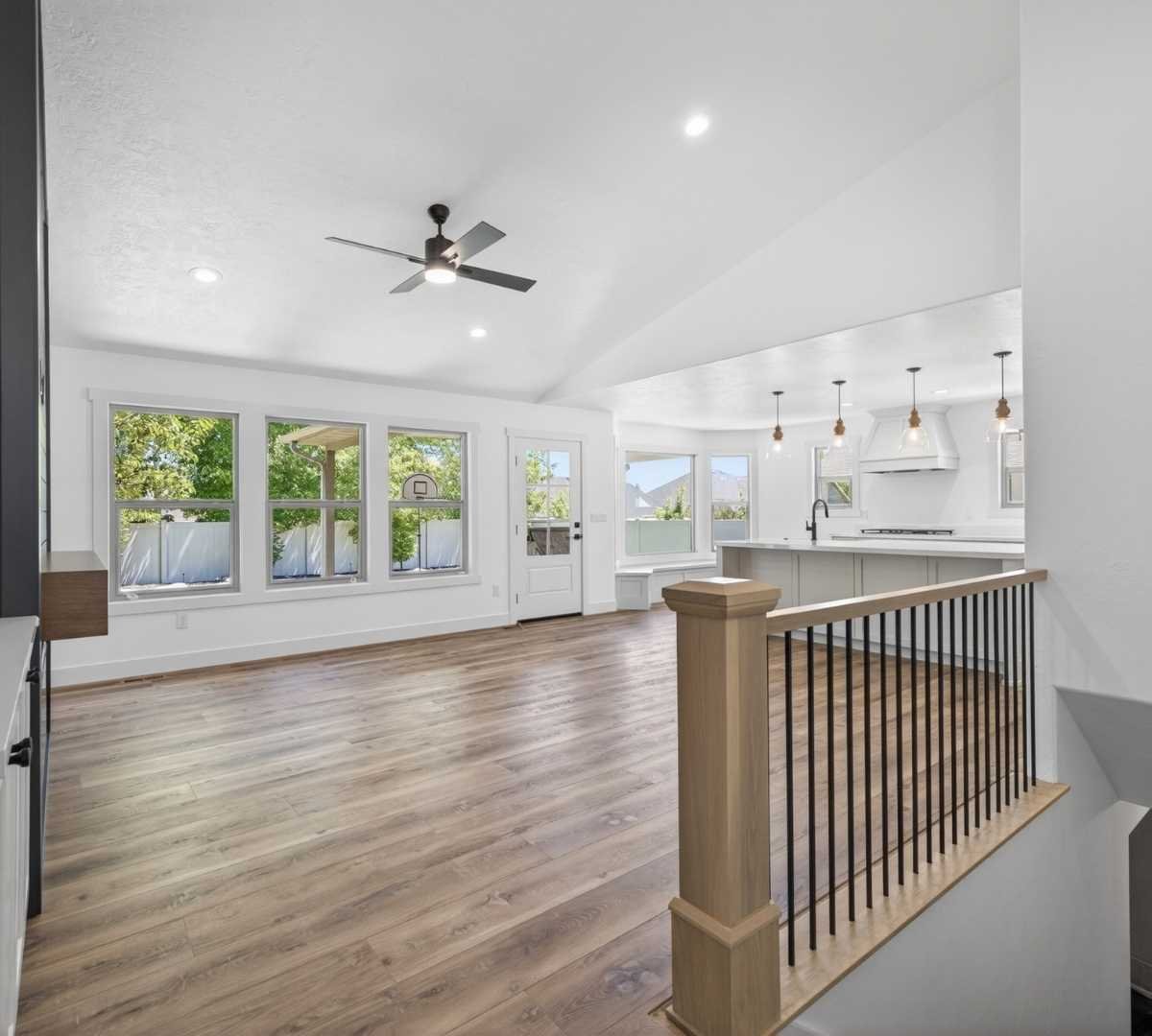 Image of open-concept home remodel with vaulted ceilings and kitchen by Marshall Homes in Herriman, UT