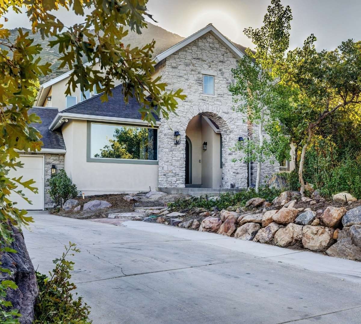 Exterior of a custom home with stone features by Marshall Homes Utah in Salt Lake City