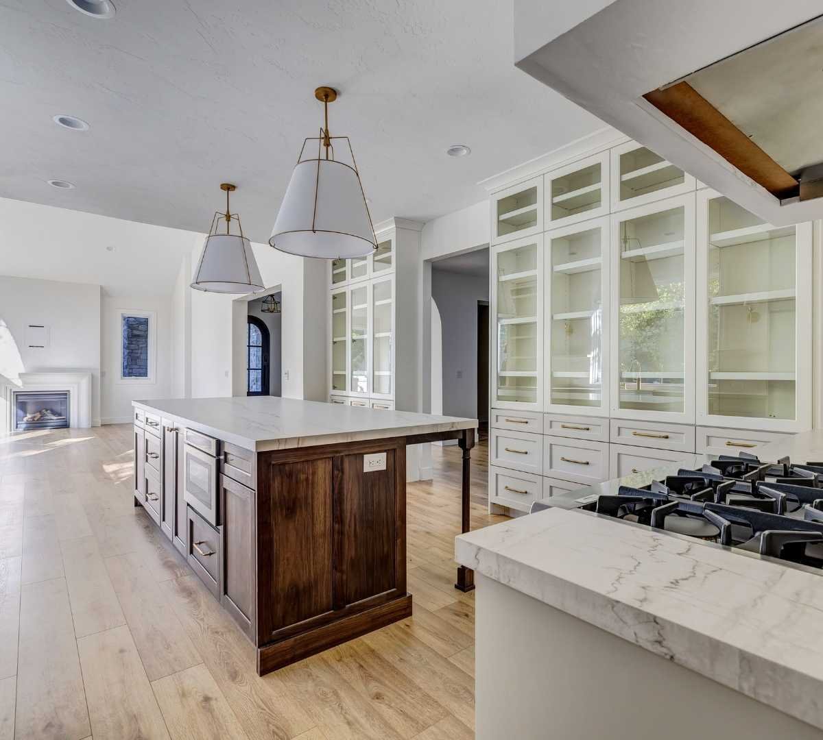 View of the kitchen and the living room by Marshall Homes Utah in Salt Lake City