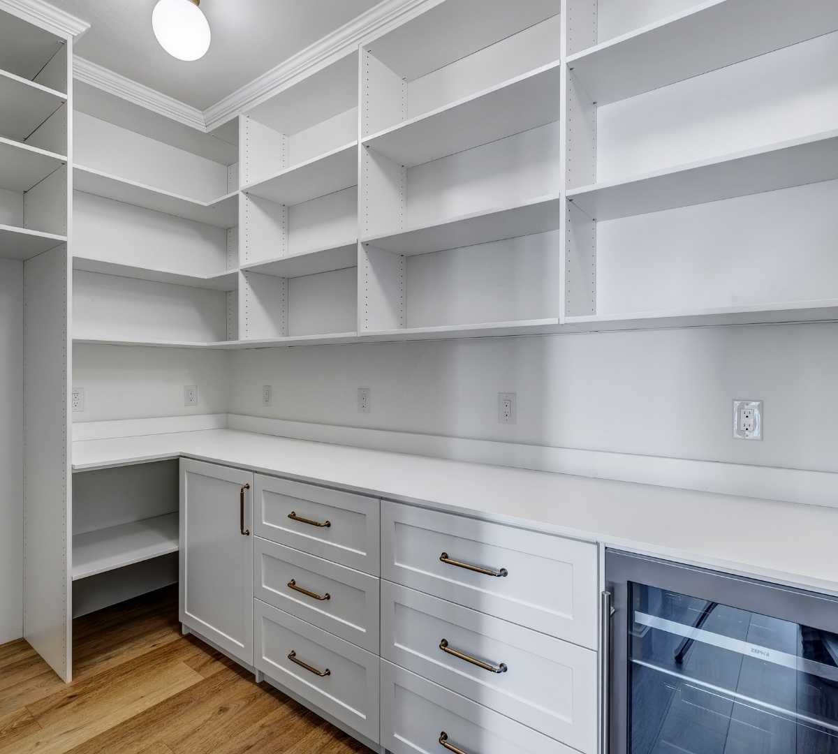 View of the kitchen pantry with built-in shelving by Marshall Homes Utah in Salt Lake City
