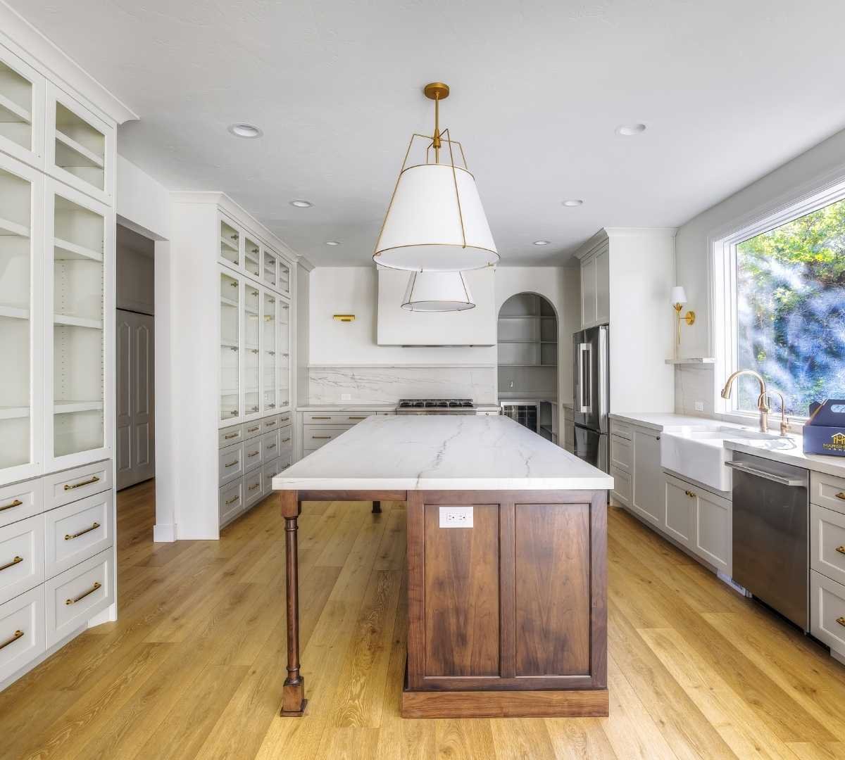 View of the kitchen with a large countertop by Marshall Homes Utah in Salt Lake City