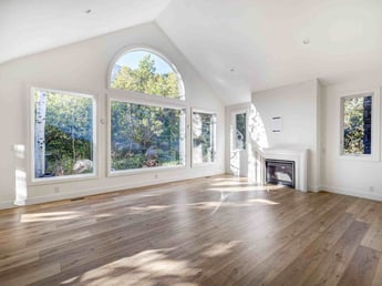 Image of great room remodel with large windows, fireplace, and natural light in Olympus Cove, UT by Marshall Homes