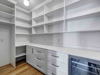 Image of the remodeled back kitchen with custom shelving and cabinets in Olympus Cove, UT by Marshall Homes