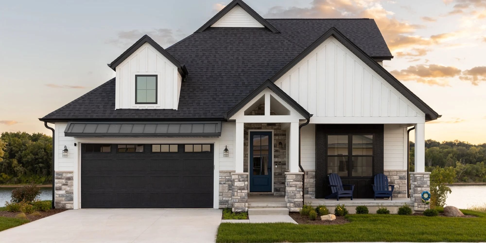 Custom Home Exterior Marshall Homes Utah with white and black design featuring a front patio with chairs Custom Home Exterior Marshall Homes Utah with white and black design featuring a front patio with chairs