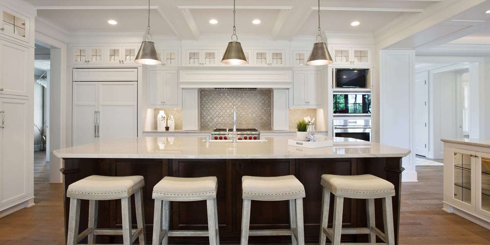 Kitchen with large island and high-end finishes by Marshall Homes - Luxury Renovations