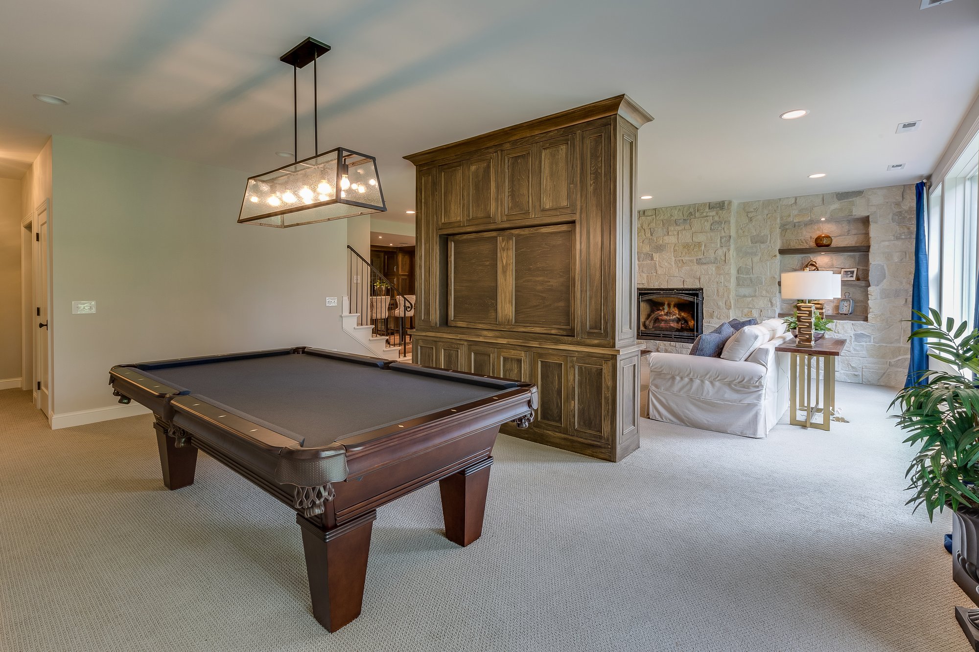 Utah-luxury-home-renovations-marshall homes-living room with pool table