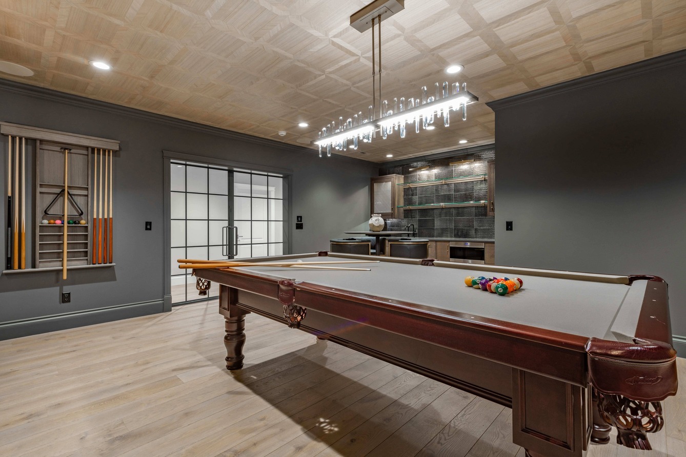Luxury basement with pool table and bar